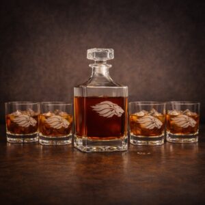 glass decanter set and glasses with a white etched engraving in the shape of a lion